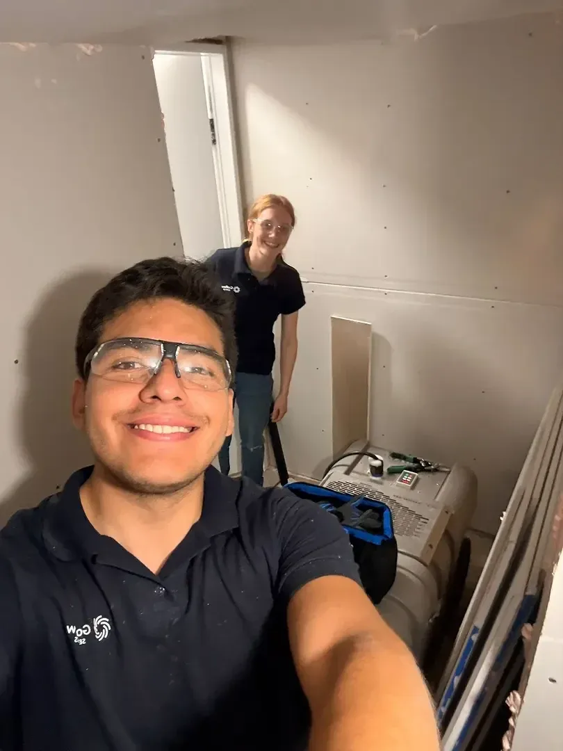 Allan and Rachel with their cleaning equipment at a job