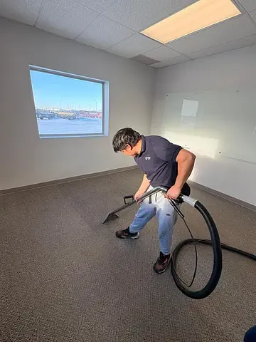 GoFlow technician cleaning an office carpet