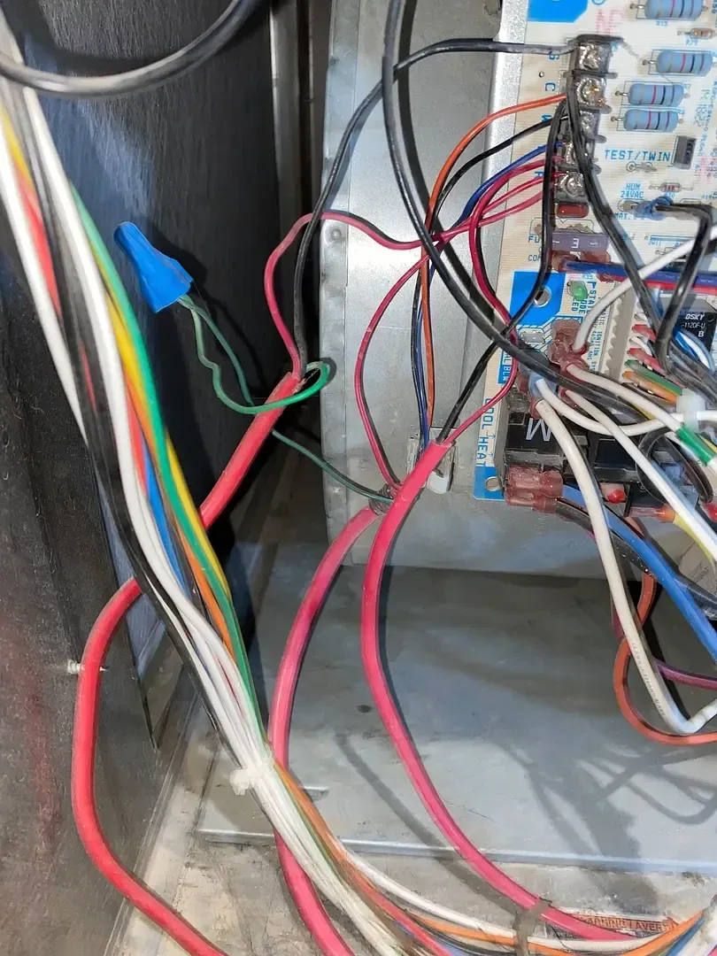 Open furnace compartment showing internal components and wiring